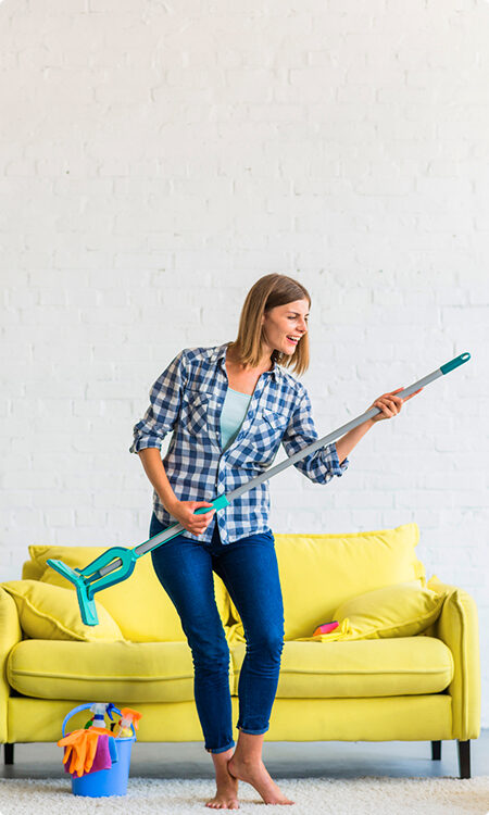 A woman holding a pair of scissors and a toothbrush.