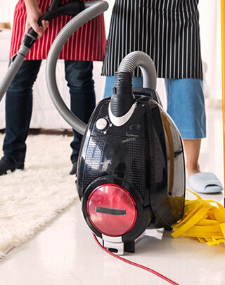 A vacuum cleaner is sitting on the floor.